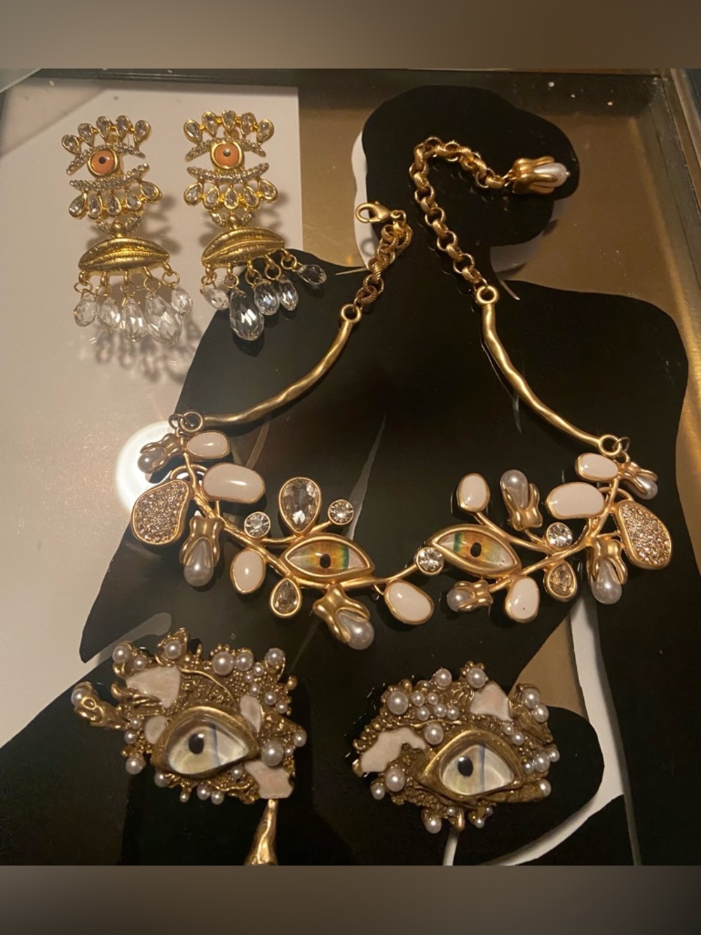 2 pairs Schiaparelli Eye Motif Earrings and a Schiaparelli Necklace